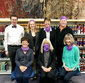 The Law-Di-Das model the snazzy purple bandanas they won. (from l-r): First row: Lisa Drew, Anne-Marie White, Anne Matthewman. Back row: David Michael, Hannah Steeves, Karen Tarum, Stephen Murray 
