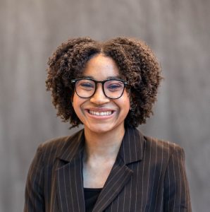Malikah Tankard smiling in a professional headshot.
