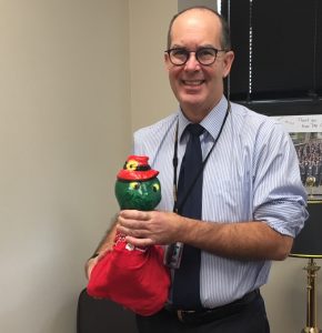 Dean Anderson of the Faculty of Medicine receiving Scrubs for their six-month term.